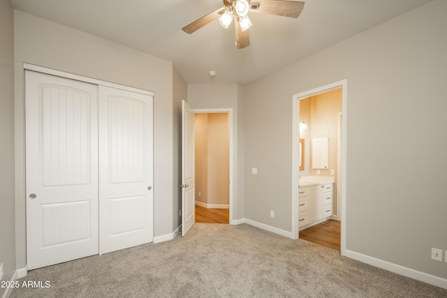 14110 E Hard Rock Rd, Prescott Valley, AZ 86315 - unfurnished bedroom with light colored carpet, a closet, baseboards, connected bathroom, and ceiling fan