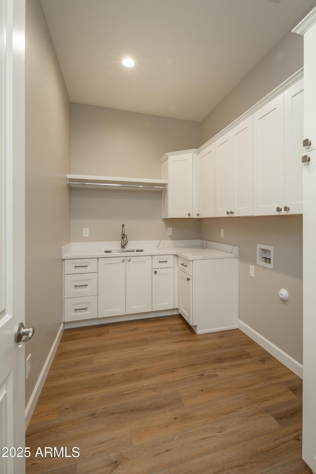 14110 E Hard Rock Rd, Prescott Valley, AZ 86315 - laundry area with cabinet space, washer hookup, baseboards, light wood-style floors, and recessed lighting