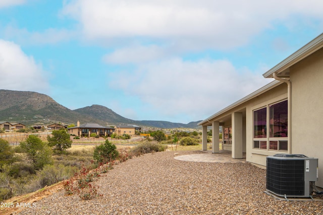 14110 E Hard Rock Rd, Prescott Valley, AZ 86315 - view of yard with central AC unit, a mountain view, and a patio area