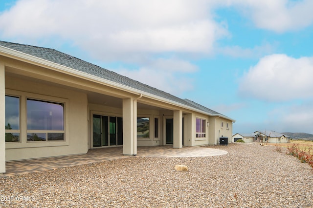 14110 E Hard Rock Rd, Prescott Valley, AZ 86315 - back of house with a patio, central AC unit, stucco siding, and roof with shingles