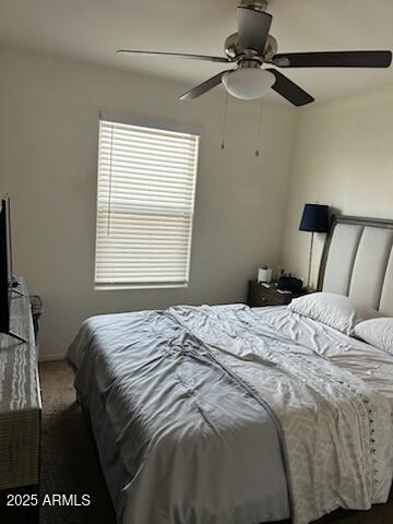 carpeted bedroom with ceiling fan
