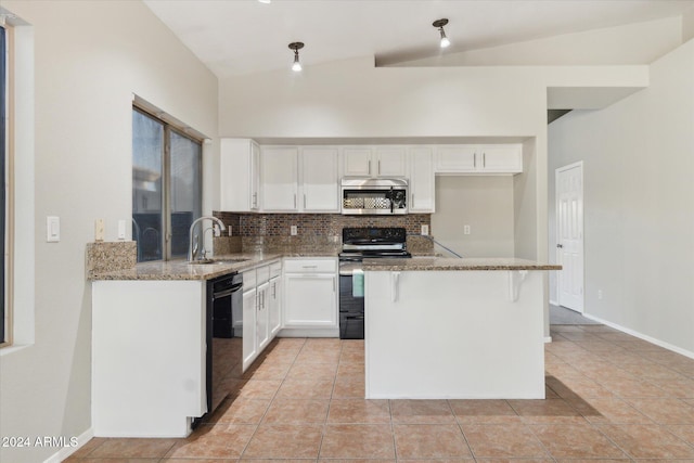 kitchen with light stone countertops, white cabinetry, sink, lofted ceiling, and black appliances