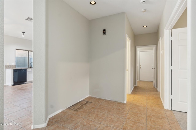 hall with light tile patterned flooring