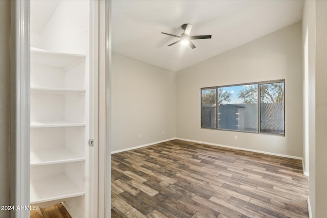 unfurnished room featuring hardwood / wood-style flooring, ceiling fan, and lofted ceiling