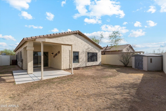 6658 E San Cristobal Way, Gold Canyon, AZ 85118 - back of house with a patio area, a fenced backyard, stucco siding, and a tile roof