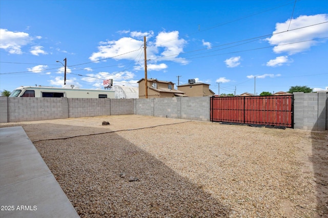 view of yard with fence private yard and a gate