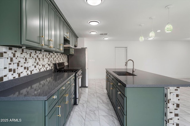 kitchen featuring visible vents, marble finish floor, gas stove, a sink, and backsplash
