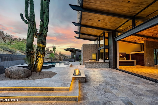 view of patio terrace at dusk