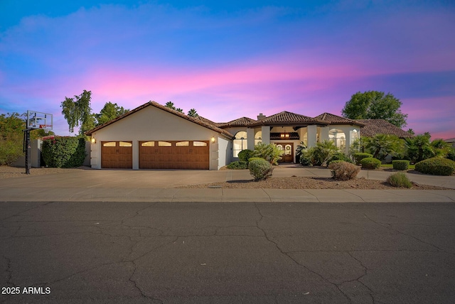 10205 E Corrine Dr, Scottsdale, AZ 85260 - mediterranean / spanish home with a garage, driveway, stucco siding, and a tiled roof