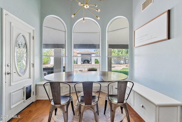 10205 E Corrine Dr, Scottsdale, AZ 85260 - dining area with wood finished floors and a chandelier