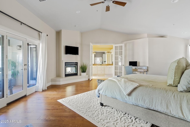 10205 E Corrine Dr, Scottsdale, AZ 85260 - bedroom with access to outside, vaulted ceiling, wood finished floors, french doors, and multiple windows