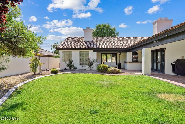 10205 E Corrine Dr, Scottsdale, AZ 85260 - rear view of property featuring a chimney, a tiled roof, stucco siding, and french doors