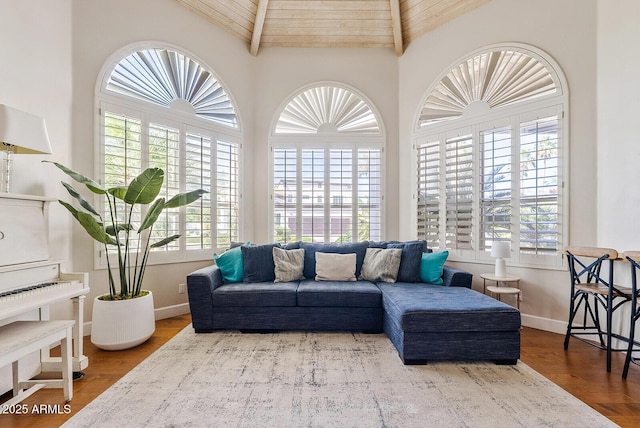 10205 E Corrine Dr, Scottsdale, AZ 85260 - living area featuring healthy amount of natural light, baseboards, wooden ceiling, wood finished floors, and high vaulted ceiling