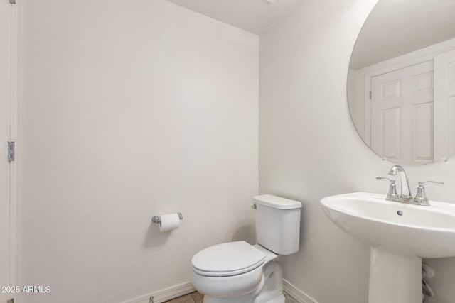 5812 W Illini St, Phoenix, AZ 85043 - half bathroom featuring baseboards and a sink