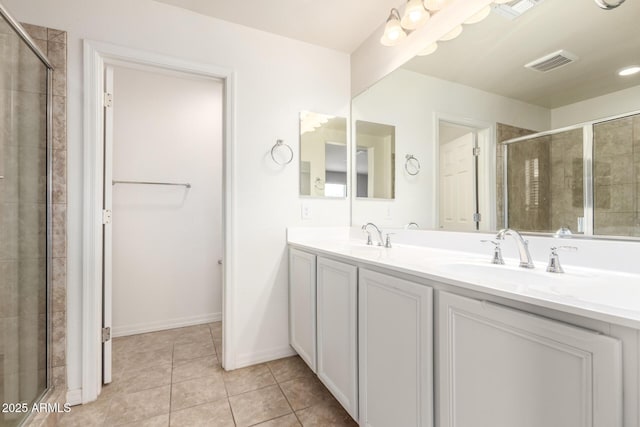 5812 W Illini St, Phoenix, AZ 85043 - full bathroom with double vanity, a stall shower, and tile patterned floors