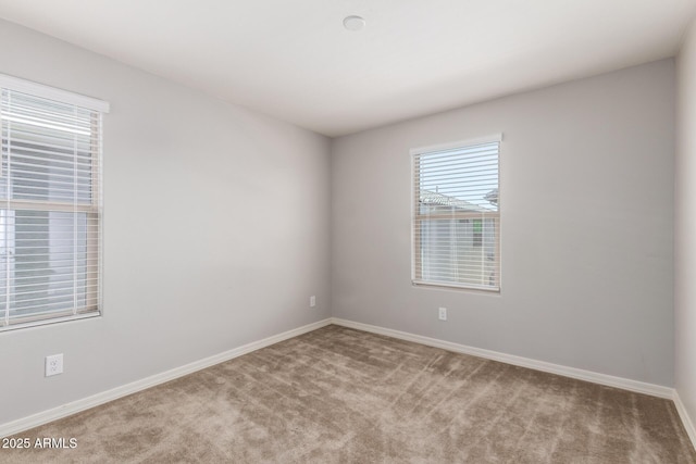 5812 W Illini St, Phoenix, AZ 85043 - carpeted spare room featuring baseboards