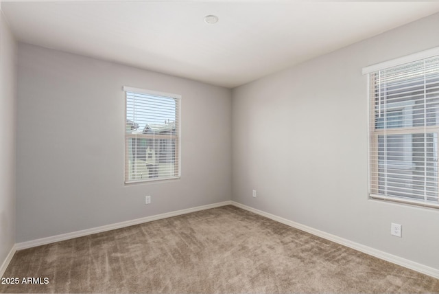5812 W Illini St, Phoenix, AZ 85043 - carpeted spare room with baseboards