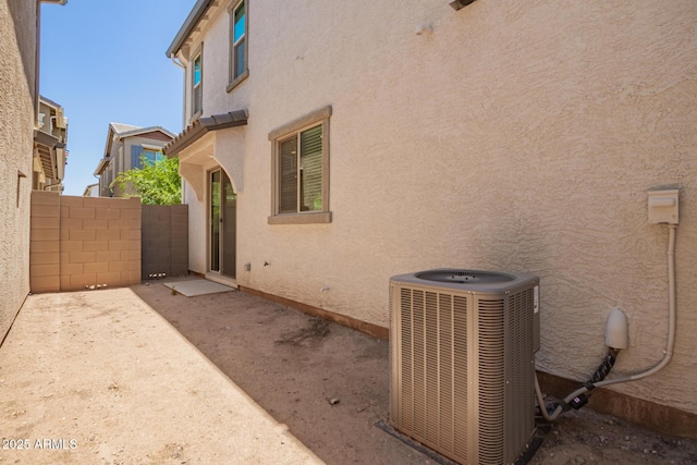 5812 W Illini St, Phoenix, AZ 85043 - view of side of property featuring stucco siding and a patio