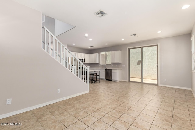 5812 W Illini St, Phoenix, AZ 85043 - unfurnished living room with stairway, recessed lighting, and light tile patterned flooring