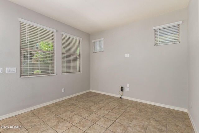 5812 W Illini St, Phoenix, AZ 85043 - spare room with baseboards