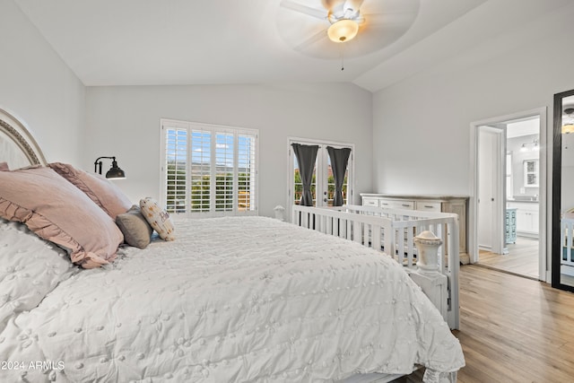 bedroom with light hardwood / wood-style flooring, lofted ceiling, and ceiling fan