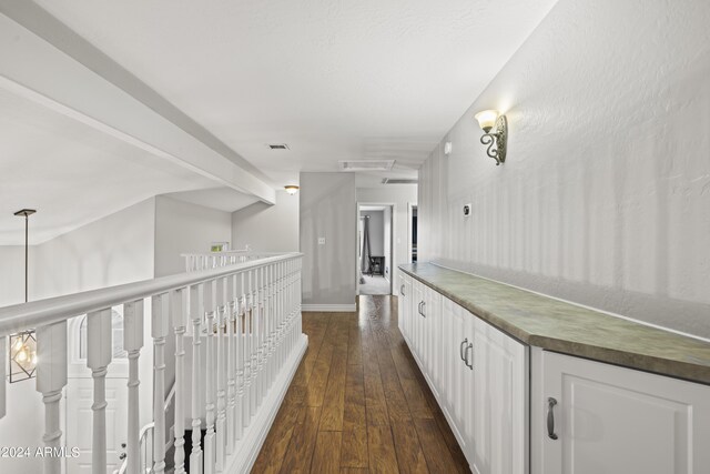 hallway with dark hardwood / wood-style floors