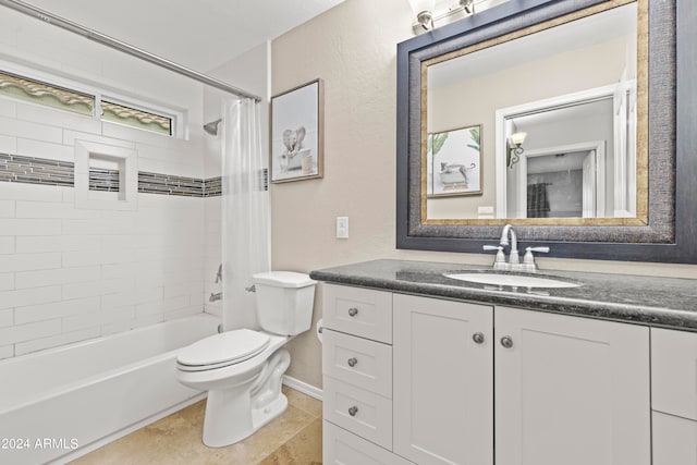 full bathroom featuring shower / tub combo, tile patterned flooring, vanity, and toilet