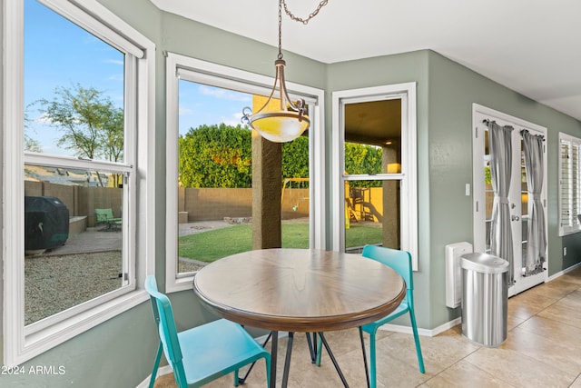 dining area with light tile patterned floors