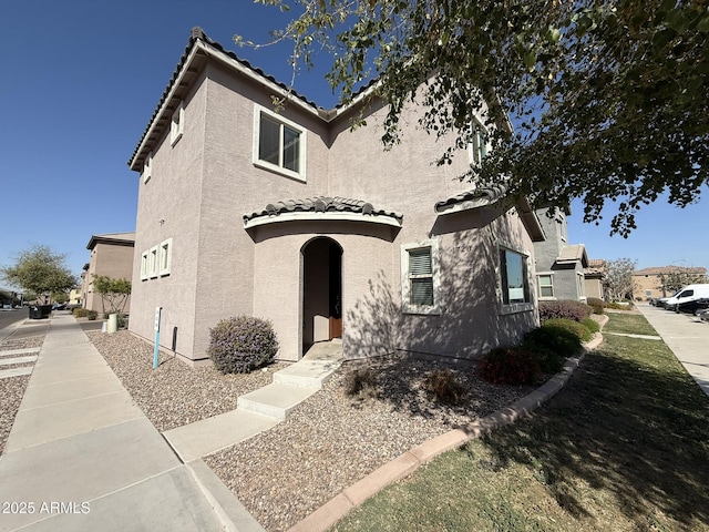 1720 W Pollack St, Phoenix, AZ 85041 - view of front of house with a tiled roof and stucco siding
