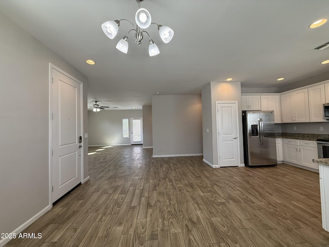 1720 W Pollack St, Phoenix, AZ 85041 - kitchen featuring stainless steel appliances, dark wood-type flooring, white cabinetry, and recessed lighting