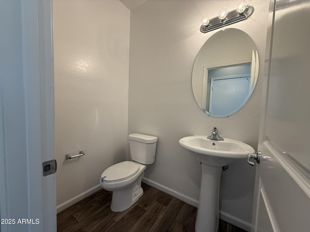 1720 W Pollack St, Phoenix, AZ 85041 - bathroom with toilet, wood finished floors, baseboards, and a sink