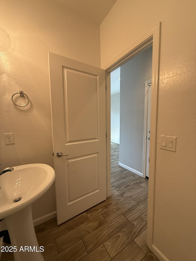 1720 W Pollack St, Phoenix, AZ 85041 - bathroom with baseboards and wood finished floors