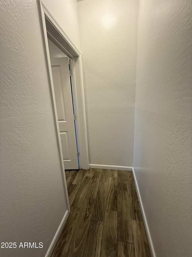 1720 W Pollack St, Phoenix, AZ 85041 - hall featuring dark wood-style flooring and baseboards