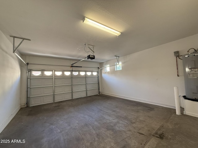 1720 W Pollack St, Phoenix, AZ 85041 - garage featuring a garage door opener, electric water heater, and baseboards