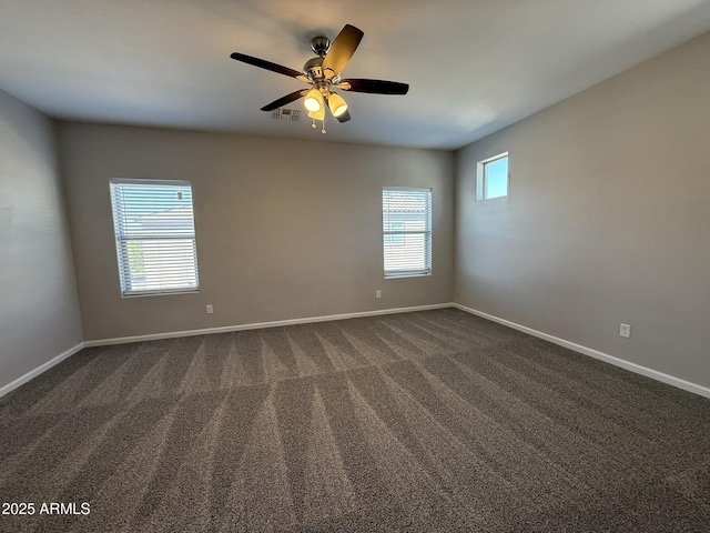 1720 W Pollack St, Phoenix, AZ 85041 - unfurnished room featuring ceiling fan, dark carpet, and baseboards