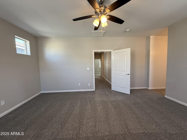1720 W Pollack St, Phoenix, AZ 85041 - unfurnished room featuring dark carpet, baseboards, and a ceiling fan