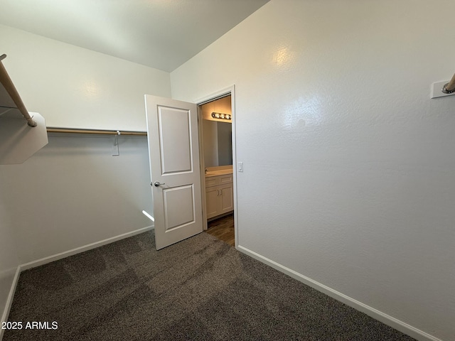 1720 W Pollack St, Phoenix, AZ 85041 - walk in closet featuring dark colored carpet
