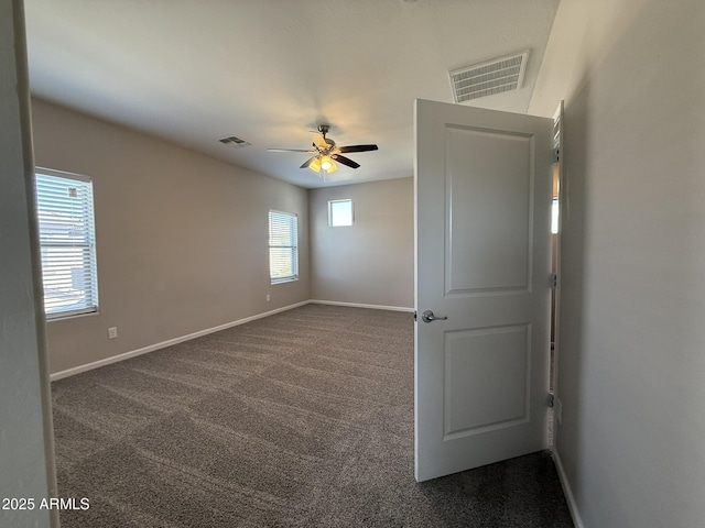 1720 W Pollack St, Phoenix, AZ 85041 - unfurnished room featuring dark carpet, a ceiling fan, and baseboards