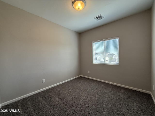 1720 W Pollack St, Phoenix, AZ 85041 - spare room with baseboards and dark carpet