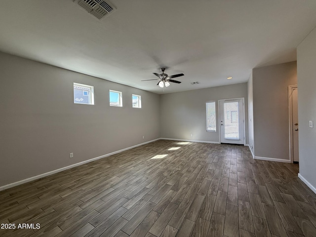 1720 W Pollack St, Phoenix, AZ 85041 - spare room with dark wood-style floors, healthy amount of natural light, and baseboards