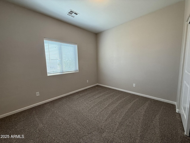 1720 W Pollack St, Phoenix, AZ 85041 - unfurnished room with dark carpet and baseboards