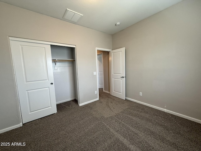 1720 W Pollack St, Phoenix, AZ 85041 - unfurnished bedroom featuring dark carpet, baseboards, and a closet