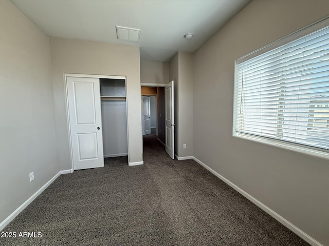 1720 W Pollack St, Phoenix, AZ 85041 - unfurnished bedroom with dark carpet and baseboards
