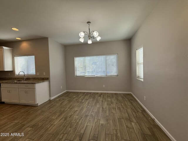 1720 W Pollack St, Phoenix, AZ 85041 - unfurnished dining area featuring a sink, a chandelier, healthy amount of natural light, dark wood-type flooring, and recessed lighting