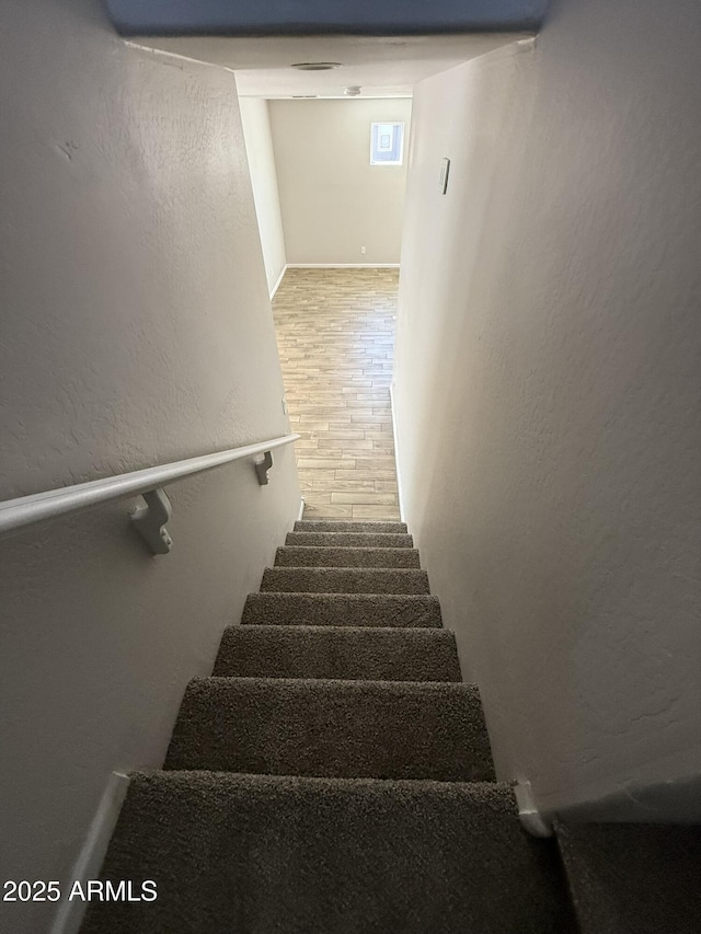 1720 W Pollack St, Phoenix, AZ 85041 - staircase with a textured wall and wood finished floors