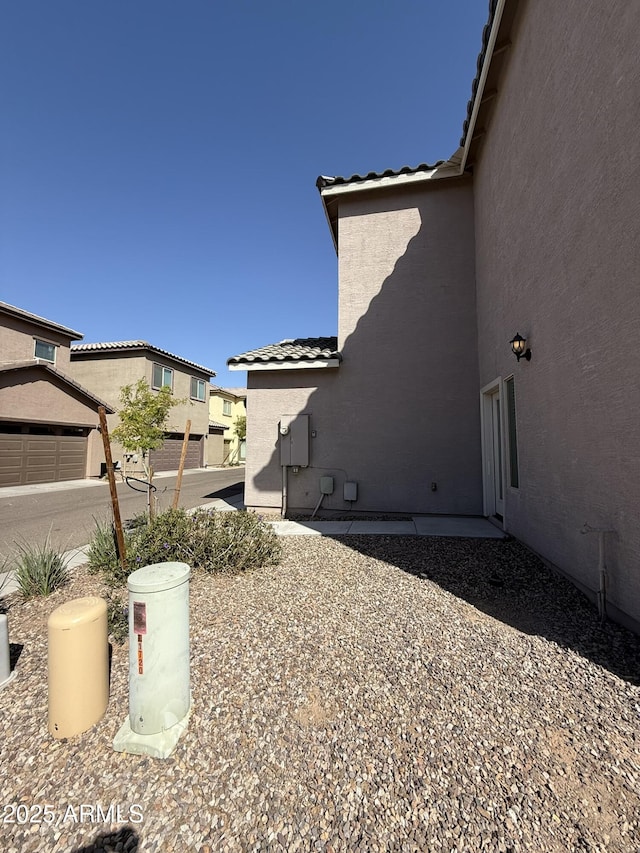 1720 W Pollack St, Phoenix, AZ 85041 - view of property exterior featuring a tiled roof and stucco siding