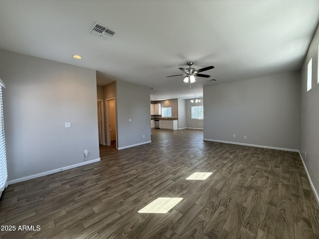 1720 W Pollack St, Phoenix, AZ 85041 - unfurnished living room with ceiling fan, dark wood-style floors, baseboards, and recessed lighting