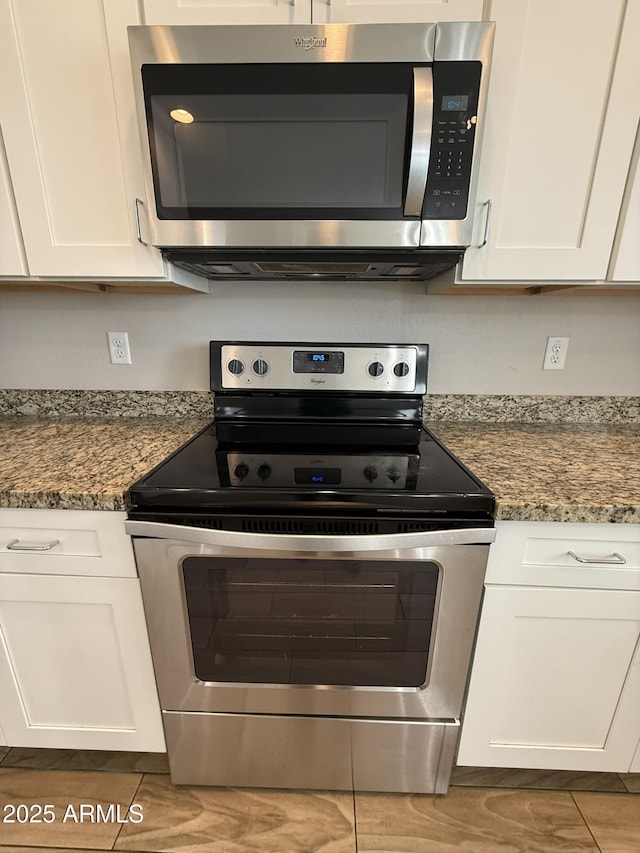 1720 W Pollack St, Phoenix, AZ 85041 - kitchen featuring appliances with stainless steel finishes and white cabinetry