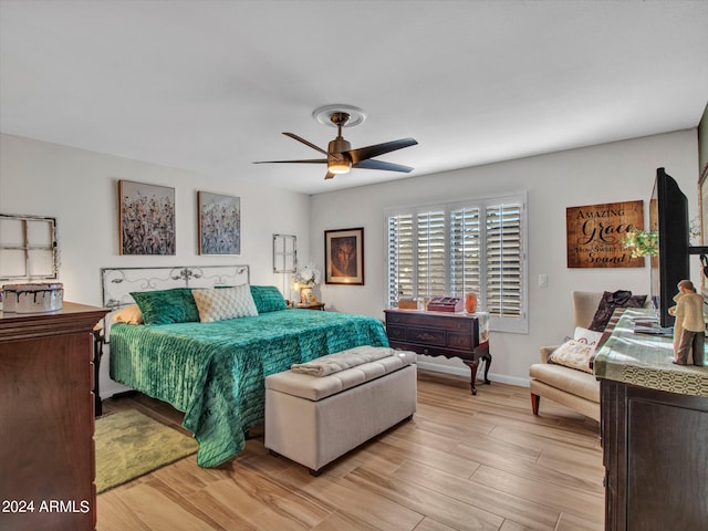 bedroom featuring light hardwood / wood-style flooring and ceiling fan