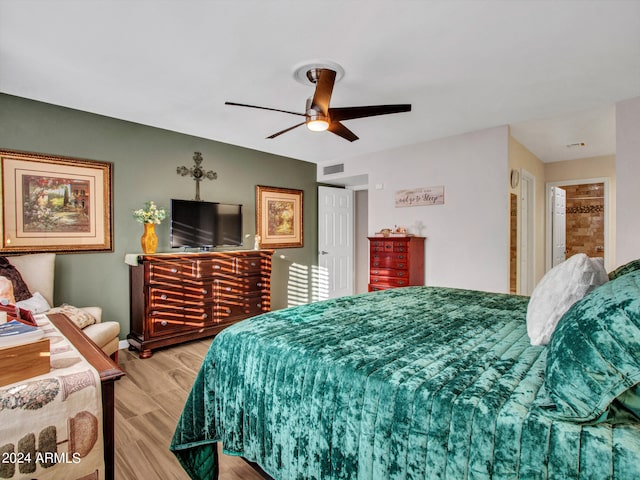 bedroom featuring ceiling fan and light hardwood / wood-style flooring